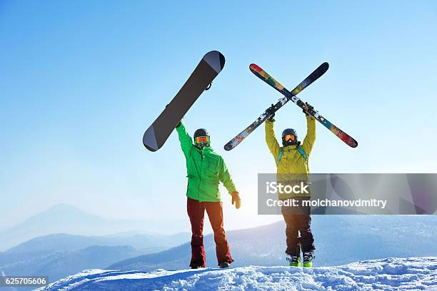 Skier And Snowboarder Mountain Top Stock Photo - Download Image Now - Skiing, Ski, Snowboarding