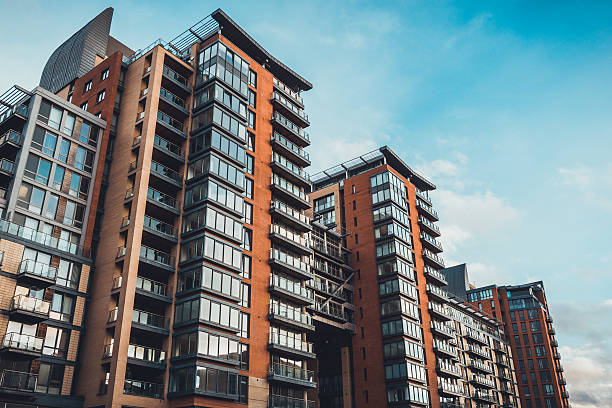 istock Sky reflecting in windows of tall condominiums 625705746