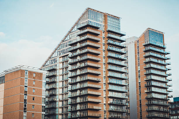 istock orange apartment buildings with glass facades 625706680