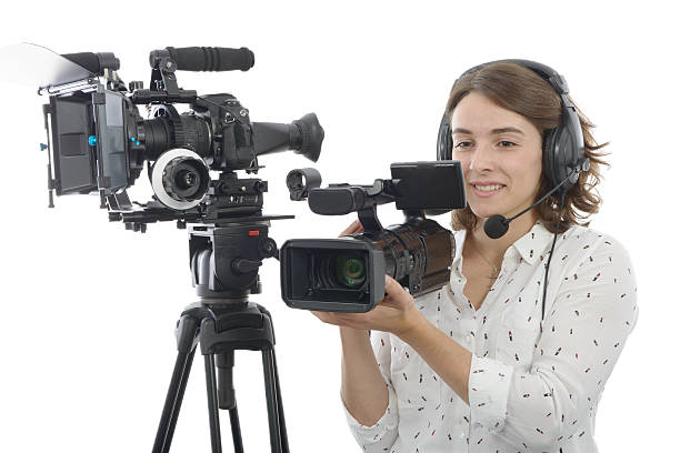 istock pretty young  girl with  professional camcorder, on white 625707280
