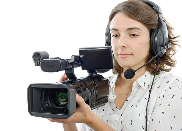 istock pretty young  girl with  professional camcorder, on white 625707862