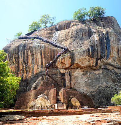 Lion's rock (Sigiriya) is a large stone and ancient fortress ruin in the central Matale District of Sri Lanka. UNESCO World Heritage Site. Composite photo