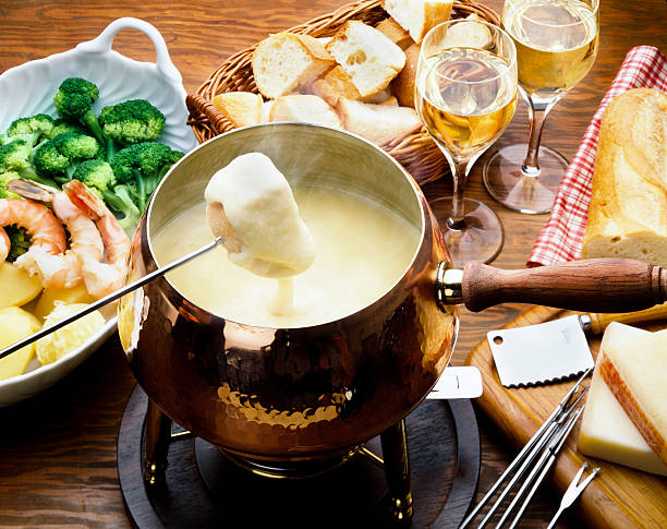 Cheese fondue cheese fondue swiss culture photos stock pictures, royalty-free photos & images