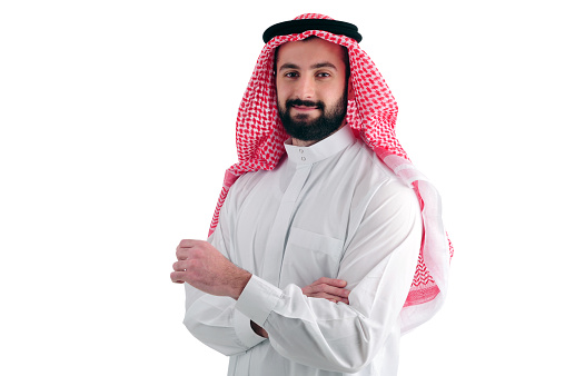 Attractive Arabian Business Man standing over a white background, success concept