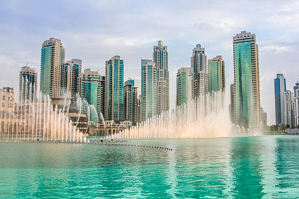 Dubai Dancing Fountain The Dubai Fountain is the world's tallest performing fountain in Downtown Dubai. The popular musical fountain of Dubai are one of the most visited attractions of the arab city. dubai mall stock pictures, royalty-free photos & images