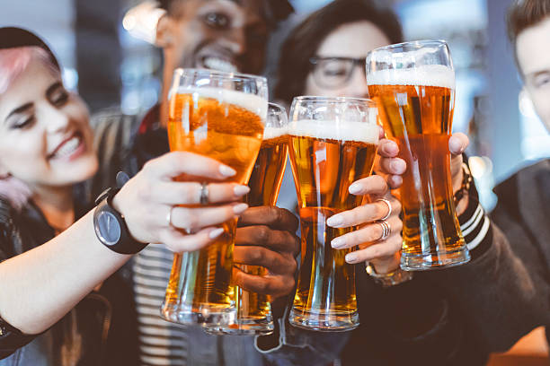 Couple toasting with beer in hand