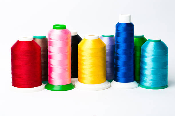 colourful spools of thread on white background - silk stockings imagens e fotografias de stock