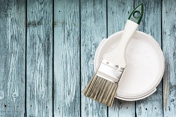 istock Open can of white paint with brush 625722828