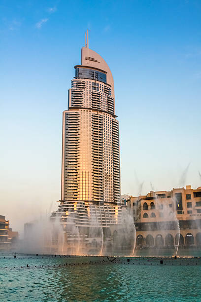 Dubai, United Arab Emirates - May 1, 2013: the popular Address Hotel during the Dubai Fountain show in the evening. The hotel is located in the Burj Khalifa Lake near the Dubai Mall.