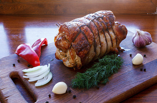 istock Roasted pork roll stuffed with vegetables and garlic 625725758