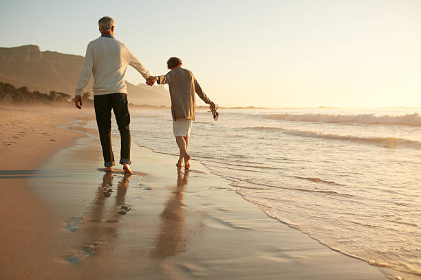istock Senior couple having fun at beach 625735244