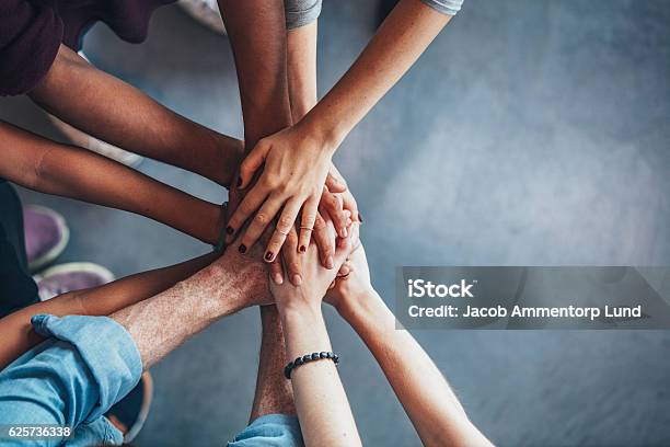 Stack Of Hands Showing Unity Stock Photo - Download Image Now - Teamwork, Togetherness, Community