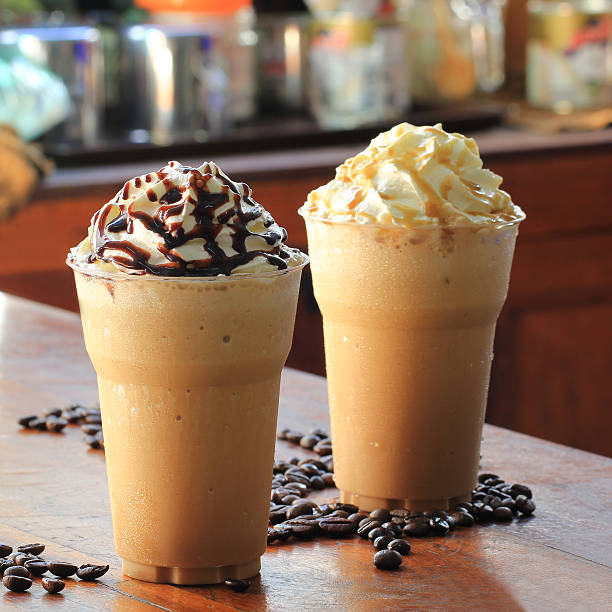 istock ice coffee and caramel smoothie on table in coffee shop. 625738148