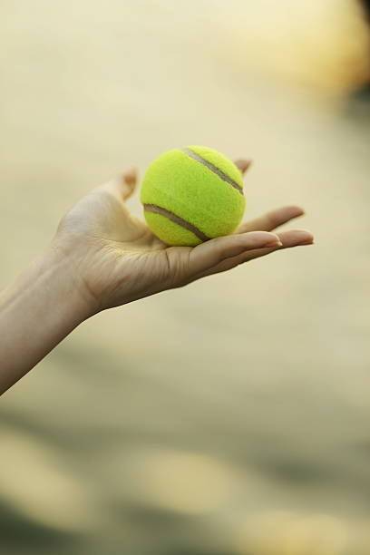 istock hand Holding a tennis ball 625739914