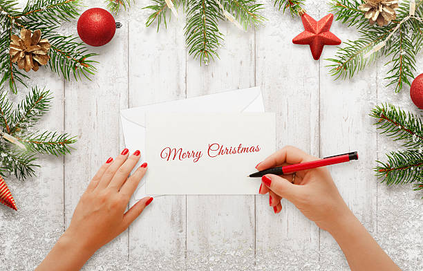 istock Woman write Christmas greeting card 625740242