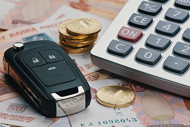 istock Russian money, calculator and key from car. 625742340