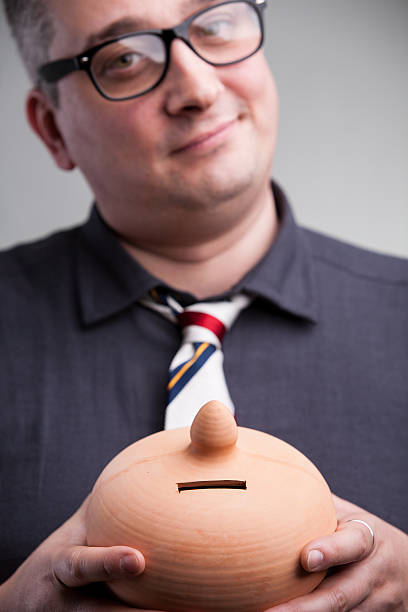 istock moneybox shown by accountant 625742350