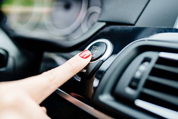 istock Woman starts the car engine with start-stop button 625743718