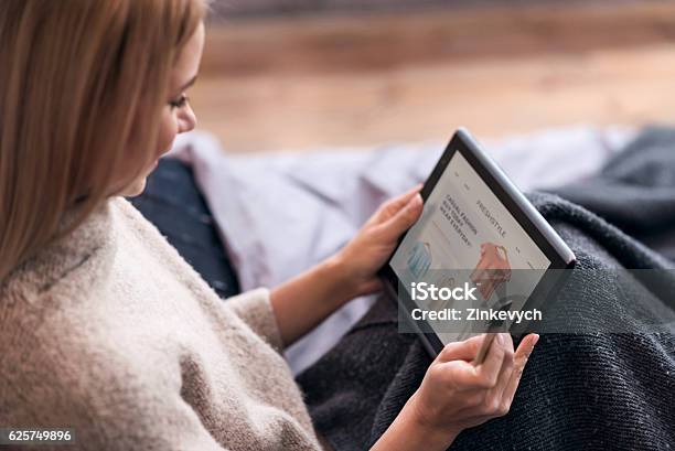 Joyful Woman Enjoying Online Shopping In Bed Stock Photo - Download Image Now - Internet, Shopping, Online Shopping