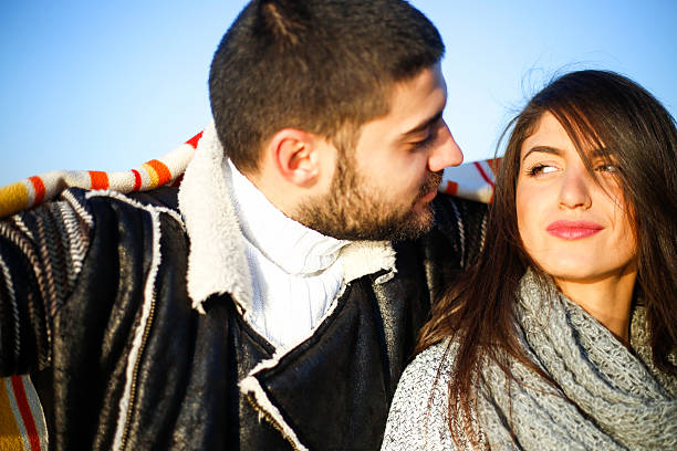istock Beautiful young lovers looking at each other 625750176
