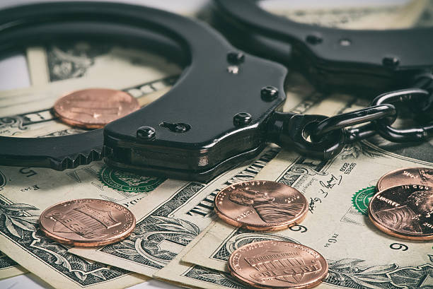 istock Handcuffs on money 625752126