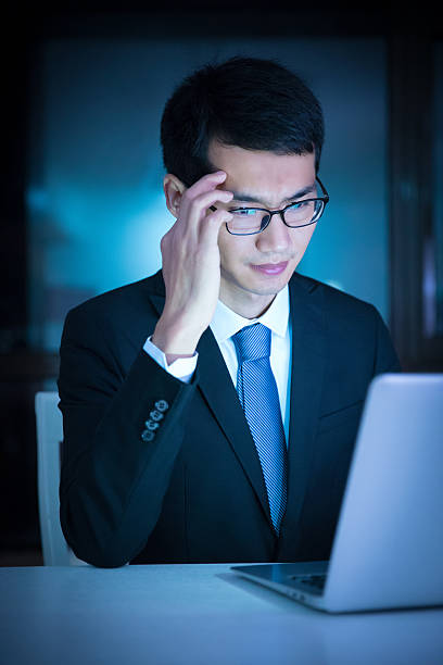 istock Stressed businessman at night 625753504