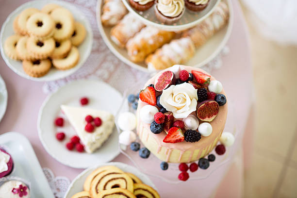 istock Cake with various berries and meringues on a stand. 625754840