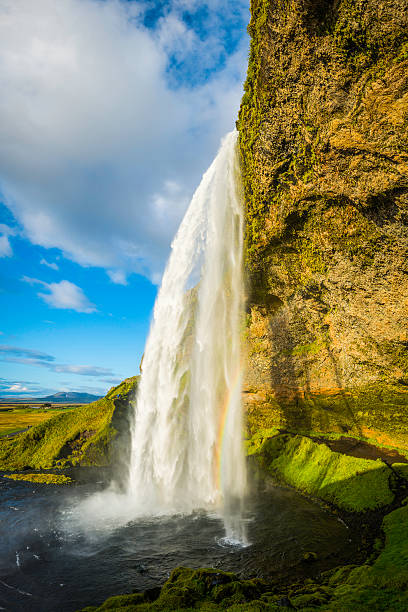 istock Waterfall cascading over mountain cliff into idyllic pool Seljalandsfoss Iceland 625755022