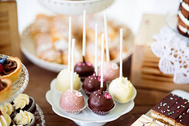 istock Cake pops on cakestand, tarts and cupcakes. Candy bar. 625755202