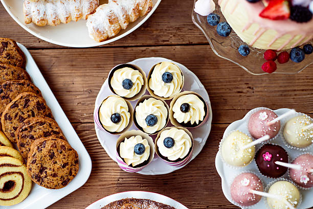 istock Table with cupcakes, cookies, cakepops and horn pastries. 625755550