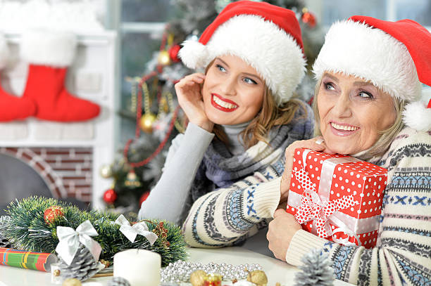 istock Two women in santa hats 625758074