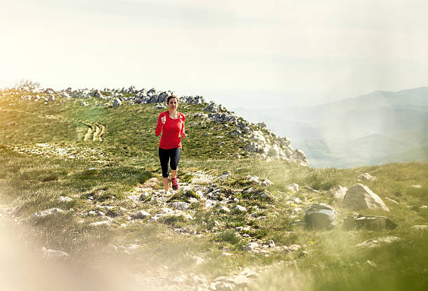 istock Athlete Running Across The Hill 625758242