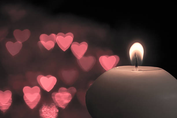 istock Candle on bokeh hearts background. Vintage style. 625758822