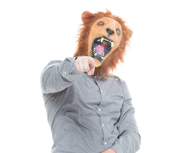 istock Man in lion costume and pointing at camera 625759032