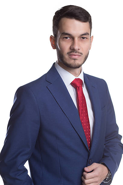 istock Businessman in suit with red tie standing on white background 625768726