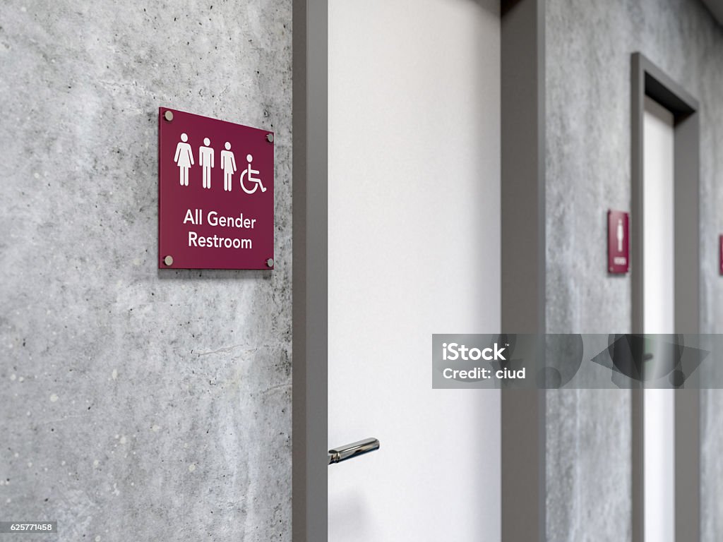All Gender Restroom Signage An all gender rest room sign next to a bathroom door Door Stock Photo
