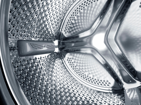 Inside the steel drum of a washing machine