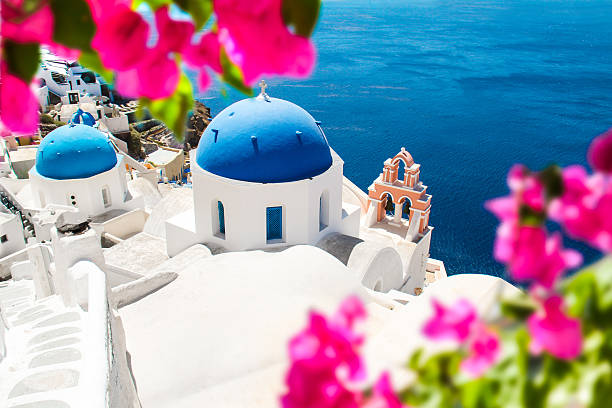 Santorini Blue domed churches in Oia, Santorini, Greece santorin stock pictures, royalty-free photos & images