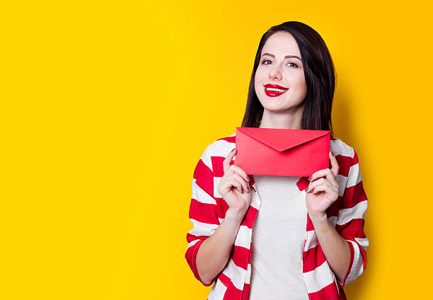 istock girl holding red gift 625779368
