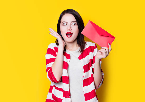 istock girl holding red gift 625779440