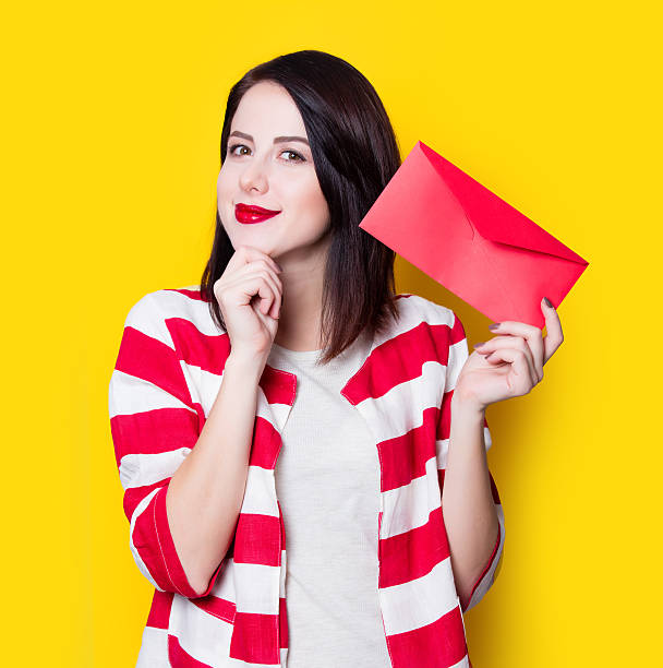 istock girl holding red gift 625779550
