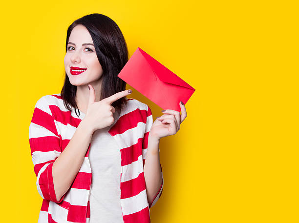 istock girl holding red gift 625779628
