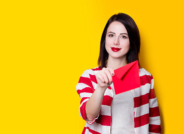 istock girl holding red gift 625779746