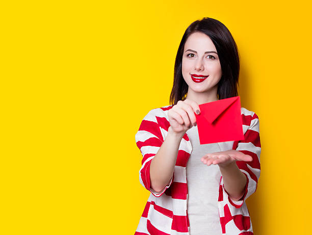 istock girl holding red gift 625779808