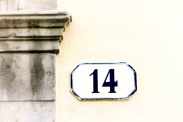 istock Number 14 Street Address Tile On Pale Yellow Wall 625780028