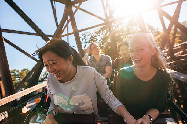 istock Young people on a thrilling roller coaster ride 625780348
