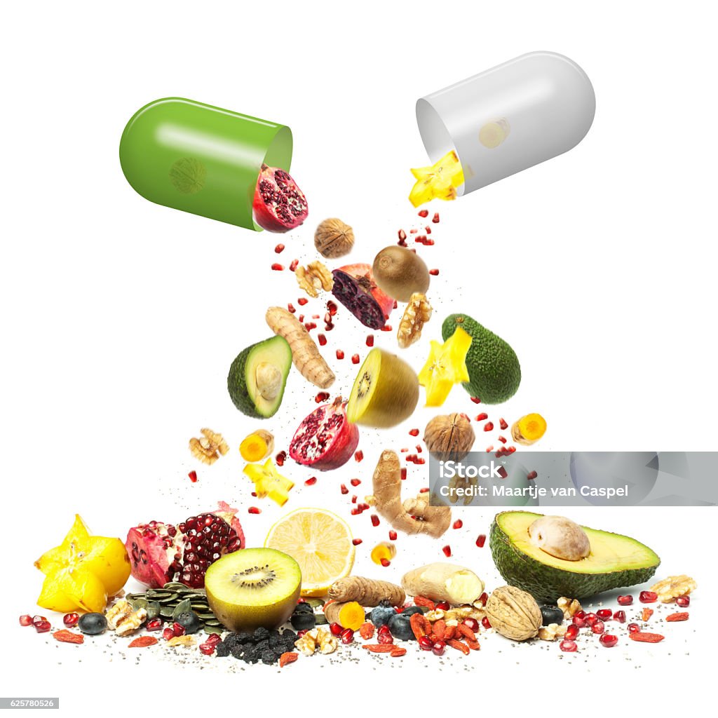 Superfood can be Medicine Superfood can be Medicine, composition with a collection of superfoods falling out of pill capsules Capsule - Medicine Stock Photo