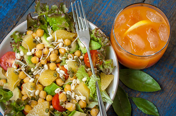 istock Healthy green salad with orange, avocado, tomatoes 625781336