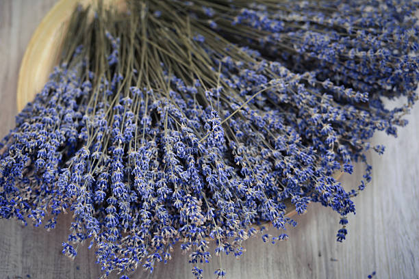 istock Lavender flower branches are on the wooden plate 625782386
