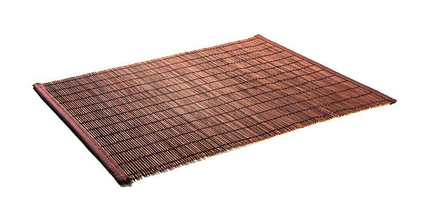 bamboo Mat - stand food brown bamboo Mat - stand food, close-up, macro bamboo fabric stock pictures, royalty-free photos & images